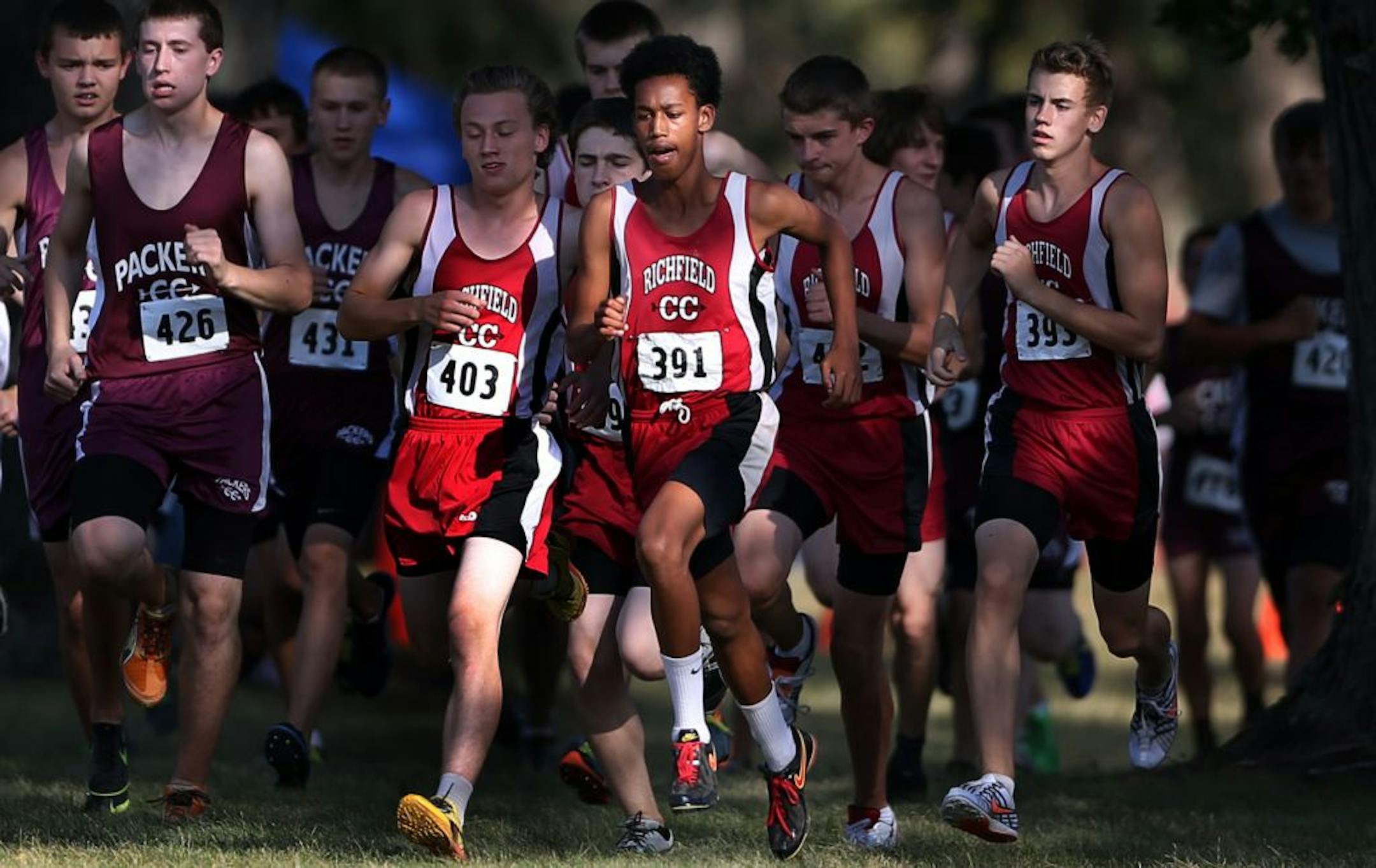 Richfield's Obsa Ali, wearing bib 391, threw up about two miles into this Classic Suburban Conference preview cross-country meet Tuesday. He still won by nearly a minute.