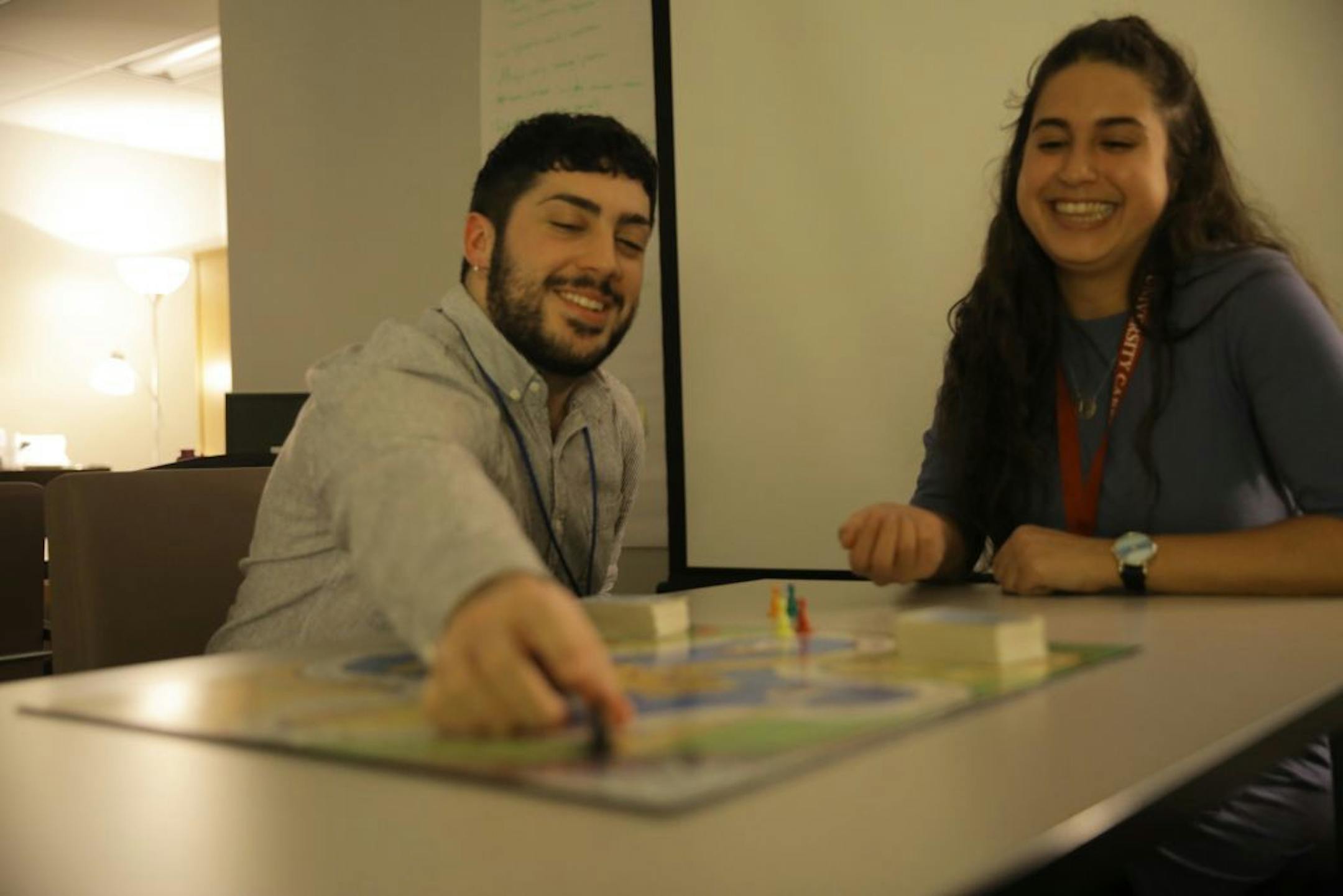 Shawn McLaughlin, left, and Ilana Stern play "Ungame," a board game used to create a positive environment and discuss personal life between students, at Temple University in the Tuttleman Counseling Center and Resiliency Resource Center on January 25, 2019.