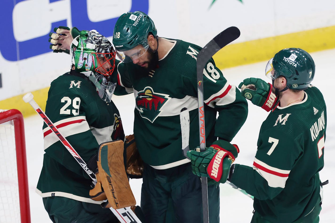 Minnesota Wild left wing Jordan Greenway (18) celebrates with Minnesota Wild goaltender Marc-Andre Fleury (29) after winning 6-3 against the Los Angeles Kings during an NHL hockey game Sunday, April 10, 2022, in St. Paul, Minn. Minnesota won 6-3. (AP Photo/Stacy Bengs)