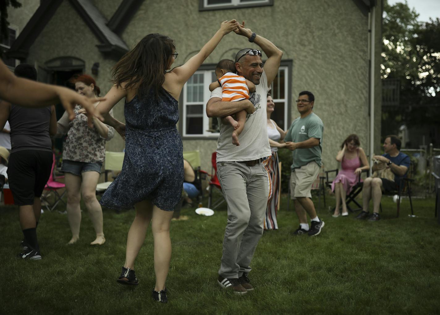 A crowd of friends, including Maria Schwedhelm and Sandro Rios, holding their son, Ilan, danced Afro Cuban style on Stephanie Owen's front yard on 28th Ave. S. Monday afternoon. Earlier in the day they had been across the street at Lake Hiawatha Park, but when rain threatened they moved the party to the front yard. "The first of many Memorial Day parties," Owen said. ] JEFF WHEELER &#xef; jeff.wheeler@startribune.com For only the second time in history, the thermometer reached 100 degrees in the