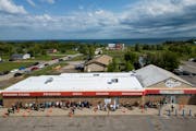People line up before grand opening Tuesday, Aug. 1, 2023 at NativeCare in Red Lake, Minn. The Red Lake Nation opened the state's first recreational m