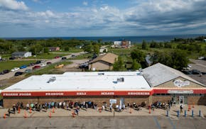 People line up before grand opening Tuesday, Aug. 1, 2023 at NativeCare in Red Lake, Minn. The Red Lake Nation opened the state's first recreational m
