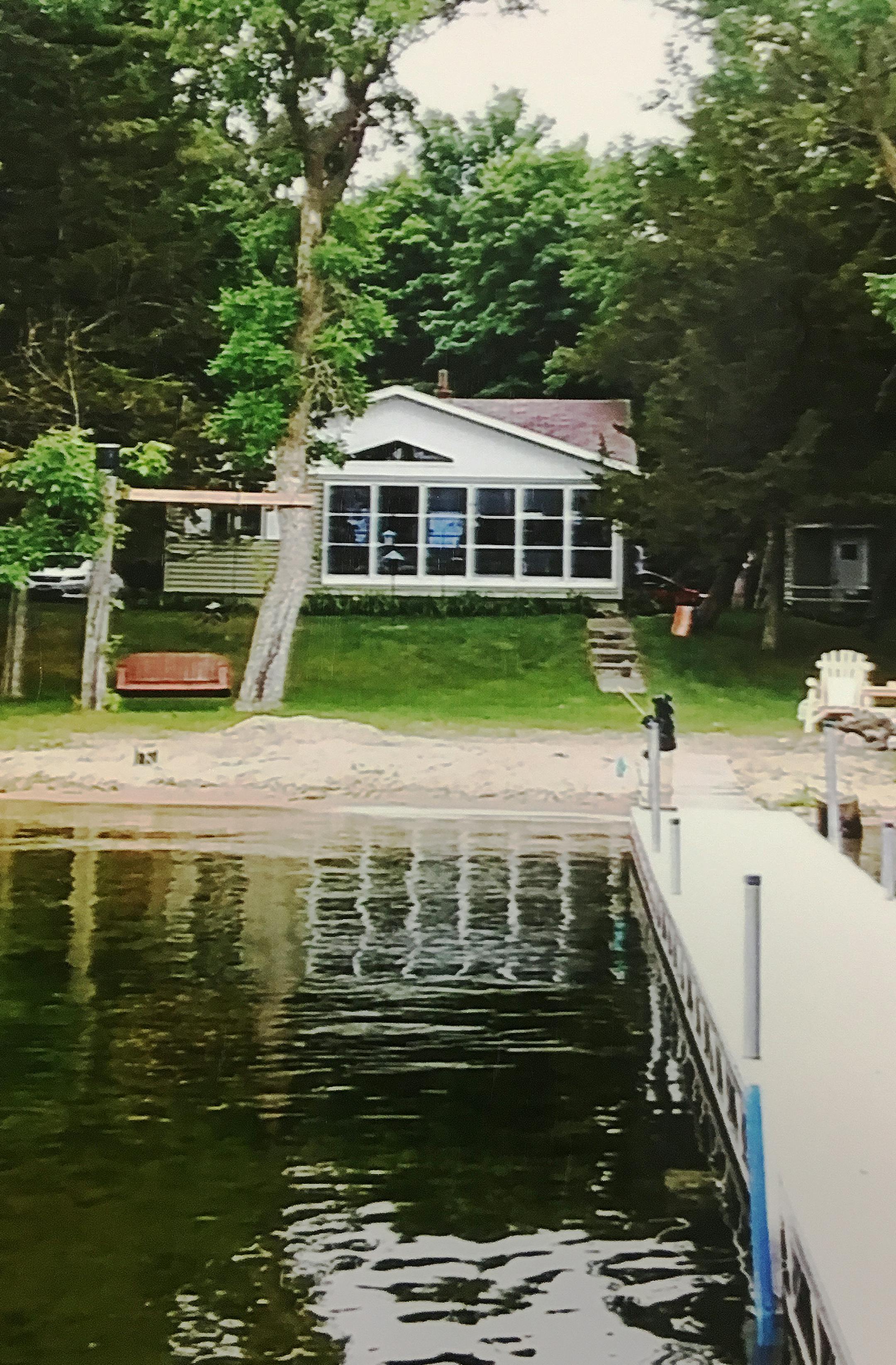 The cabin, bought in 1966, has given the family the required trappings: a good fishing lake with a safe, sandy beach for children.