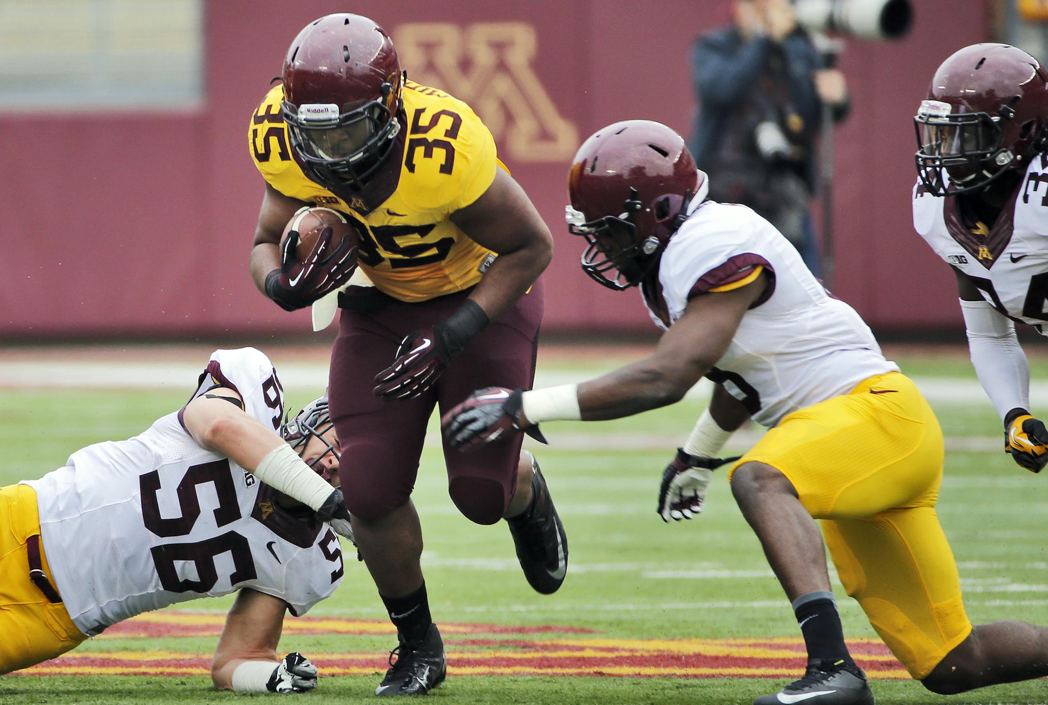 Running back Rodrick Williams (35) drove through the defense. ] Minnesota Gophers Spring football scrimmage. (MARLIN LEVISON/STARTRIBUNE(mlevison@startribune.com)