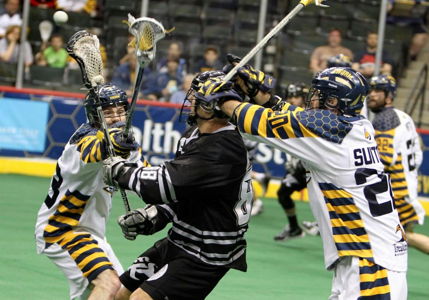 In a playoff game last season, Minnesota's Jeff Gilbert, left, lunges for the ball as Edmonton's Zack Greer passes