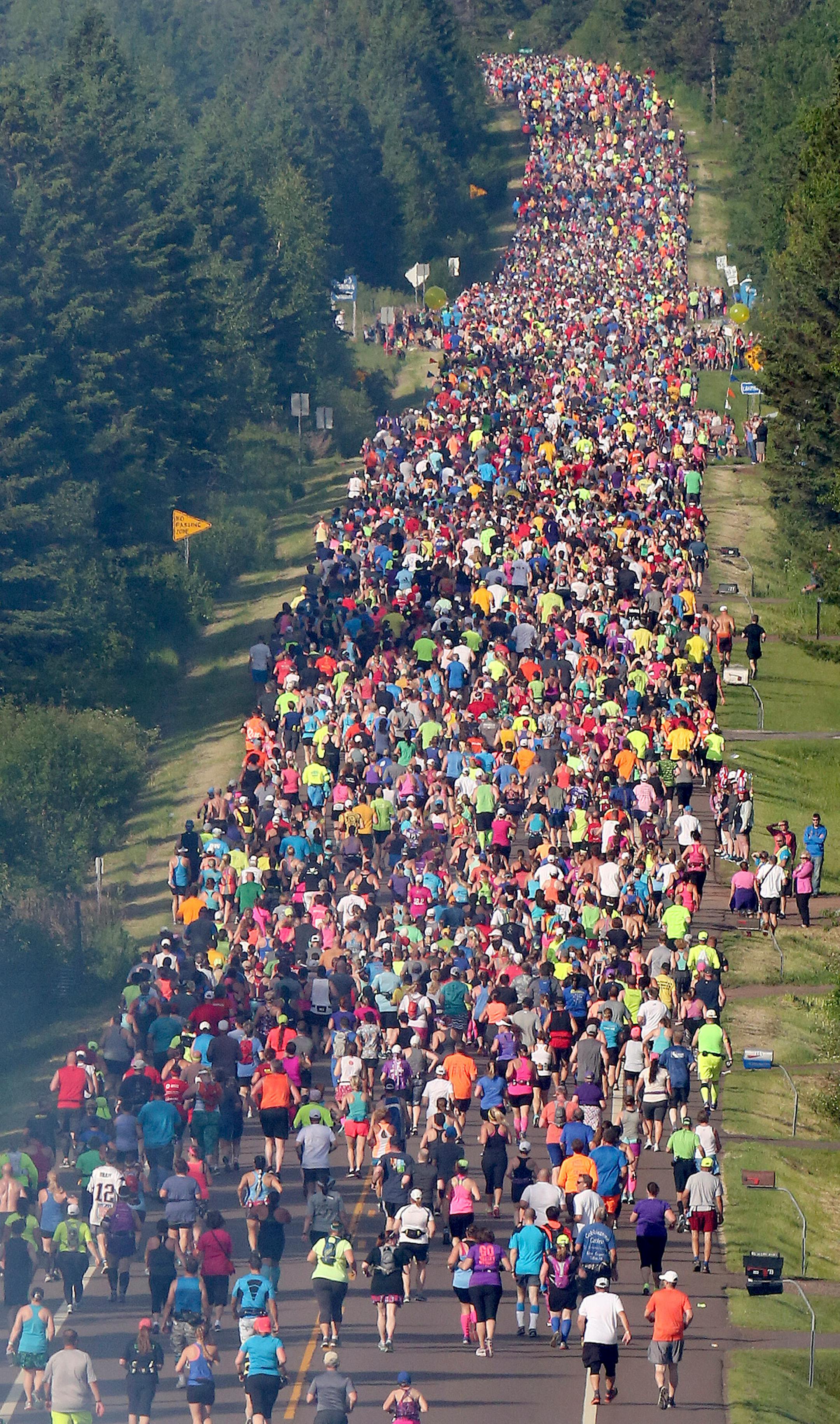 The pack covers Scenic Highway 61 shortly after the start of Grandma�s Marathon on Saturday.