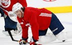Washington Capitals right wing T.J. Oshie smiles as he stretches out with teammates during an NHL hockey practice Wednesday, June 6, 2018, in Las Vega