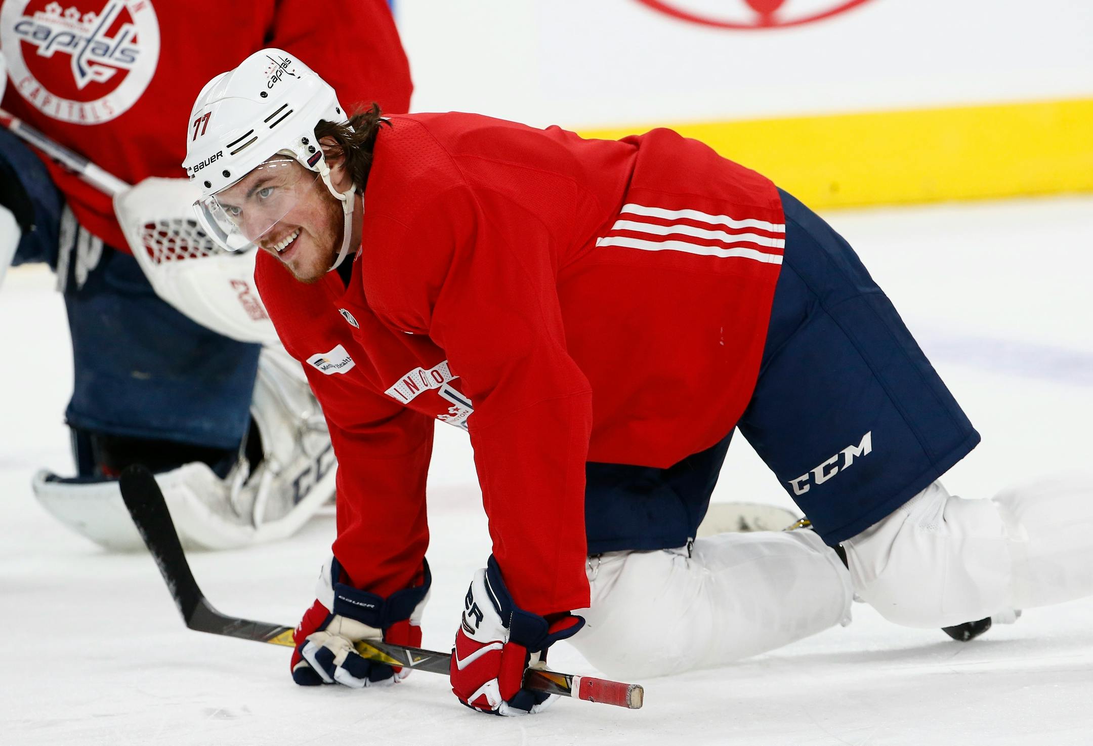 Washington Capitals right wing T.J. Oshie smiles as he stretches out with teammates during an NHL hockey practice Wednesday, June 6, 2018, in Las Vegas. The Capitals lead the Vegas Golden Knights 3-1 in the best-of-seven Stanley Cup Finals series. (AP Photo/Ross D. Franklin)