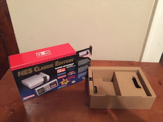 An eBay listing shows just the box for the NES Classic Edition for sale.