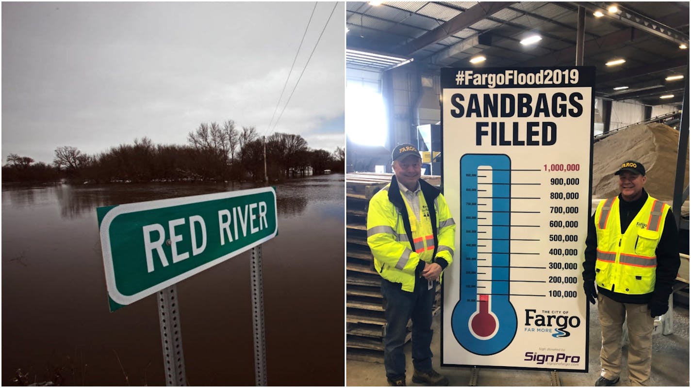 Fargo Mayor Tim Mahoney, left, and City Administrator Bruce Grubb pose next to a sandbag tote board in Fargo on March 29. The city aimed to make 100,000 sandbags a day and have 1 million bags completed within two weeks to help ward off possible flooding from the Red River.