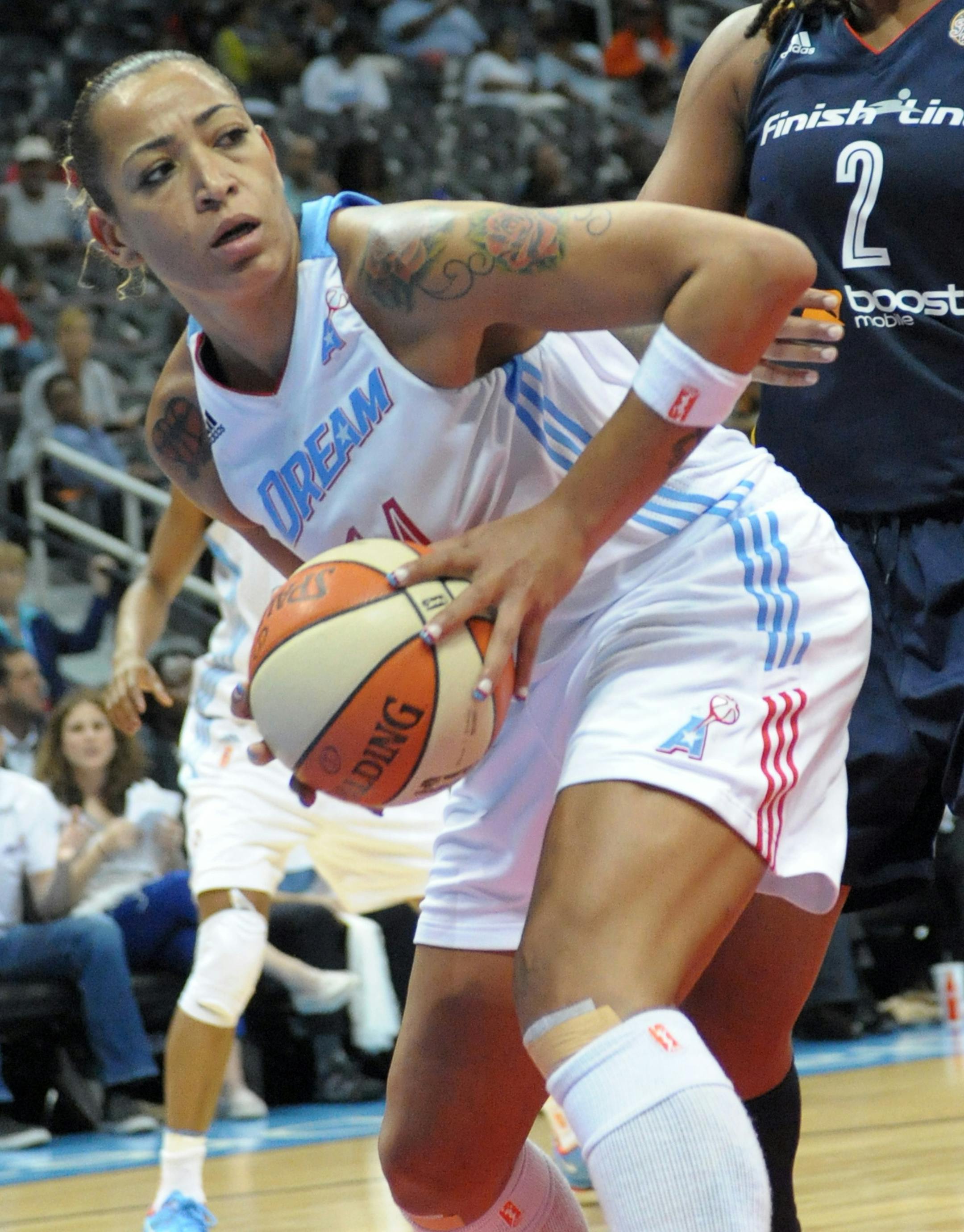 Atlanta Dream's Erika de Souza (14) controls the ball in front of Indiana Fever's Erlana Larkins (2) in the second half of Game 1 of the WNBA basketball Eastern Conference finals on Thursday, Sept. 26, 2013, in Atlanta. Atlanta won 84-79. (AP Photo/David Tulis) ORG XMIT: MIN2013100515535429
