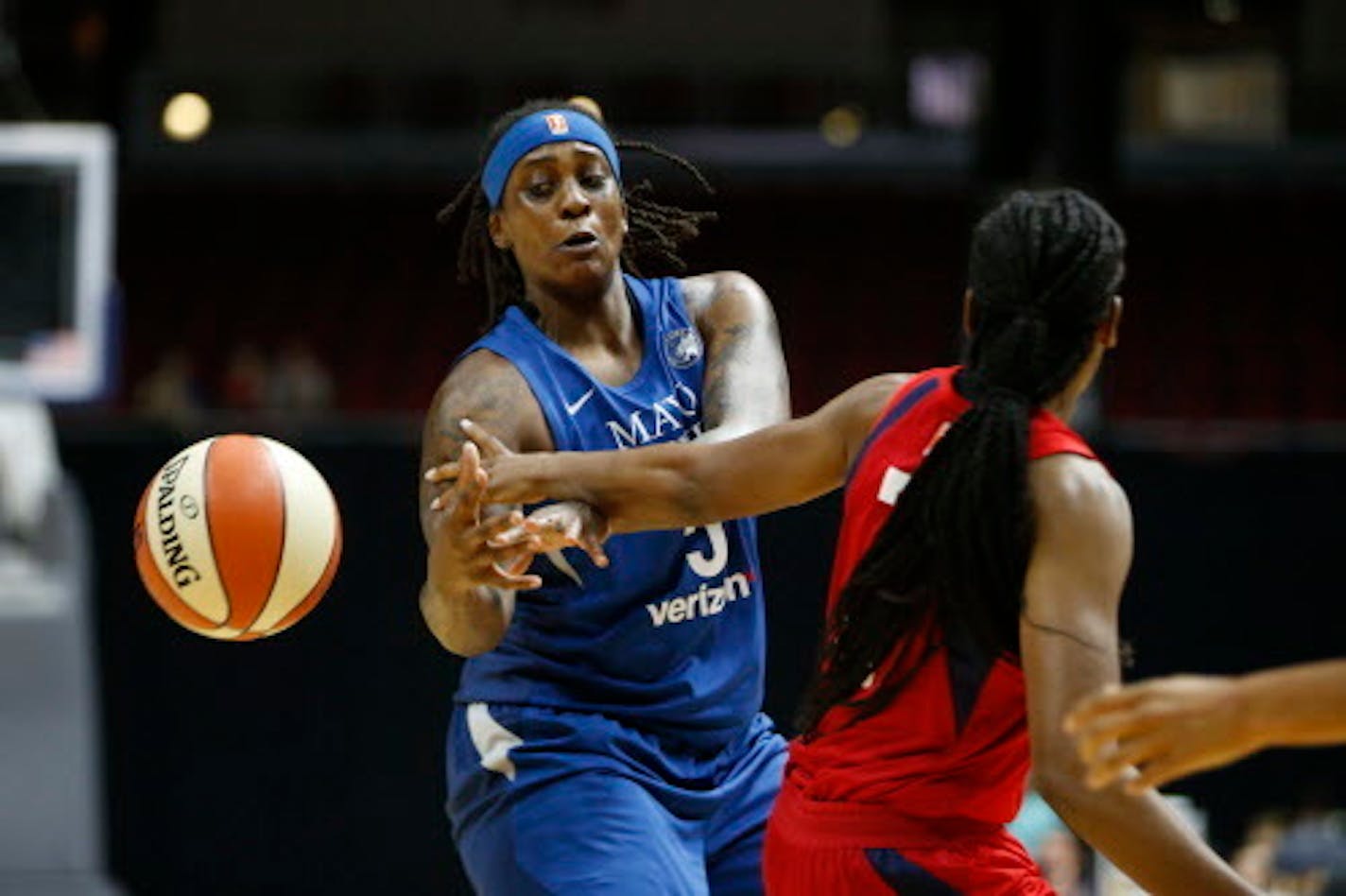 Lynx forward Lynetta Kizer (5) gets the ball knocked away by Mystics guard Ariel'Atkins (7) Sunday, May 6, 2018, during their WNBA preseason game at Wells Fargo Arena in Des Moines, Iowa.