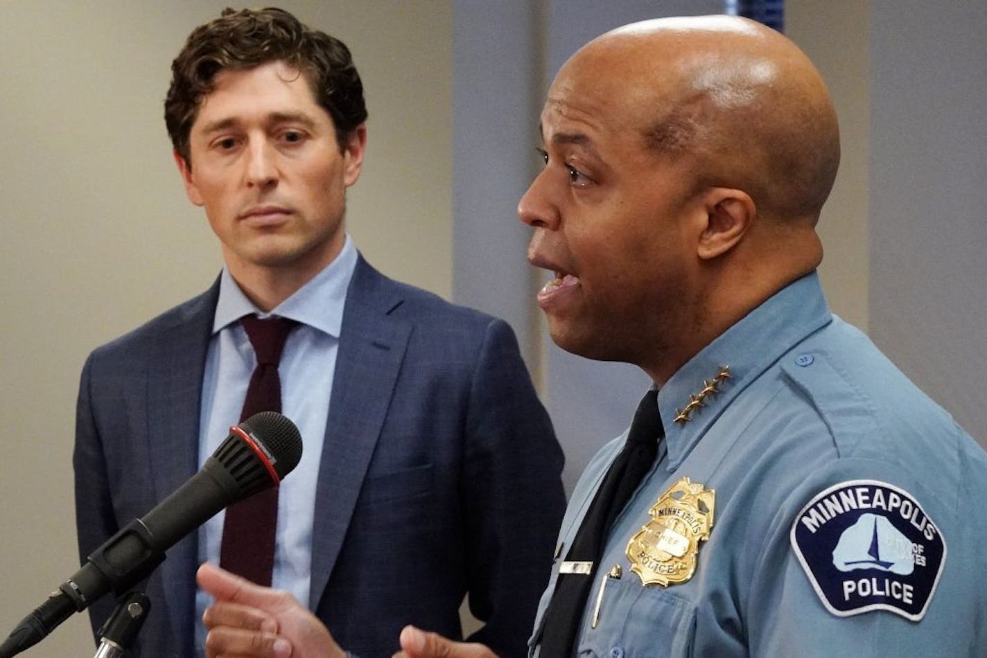 Minneapolis Mayor Jacob Frey, standing a distance from police Chief Medaria Arradondo, watched as the chief outlined how the city will enforce the new stay-at-home order during a press conference Friday.