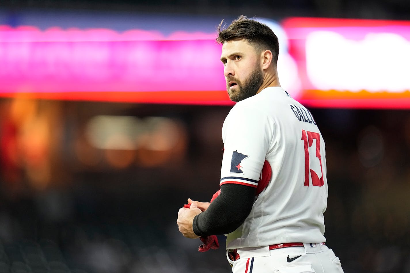 Minnesota Twins' Joey Gallo stands on the field after the end of the bottom of the fifth inning of a baseball game against the New York Yankees, Monday, April 24, 2023, in Minneapolis. (AP Photo/Abbie Parr)