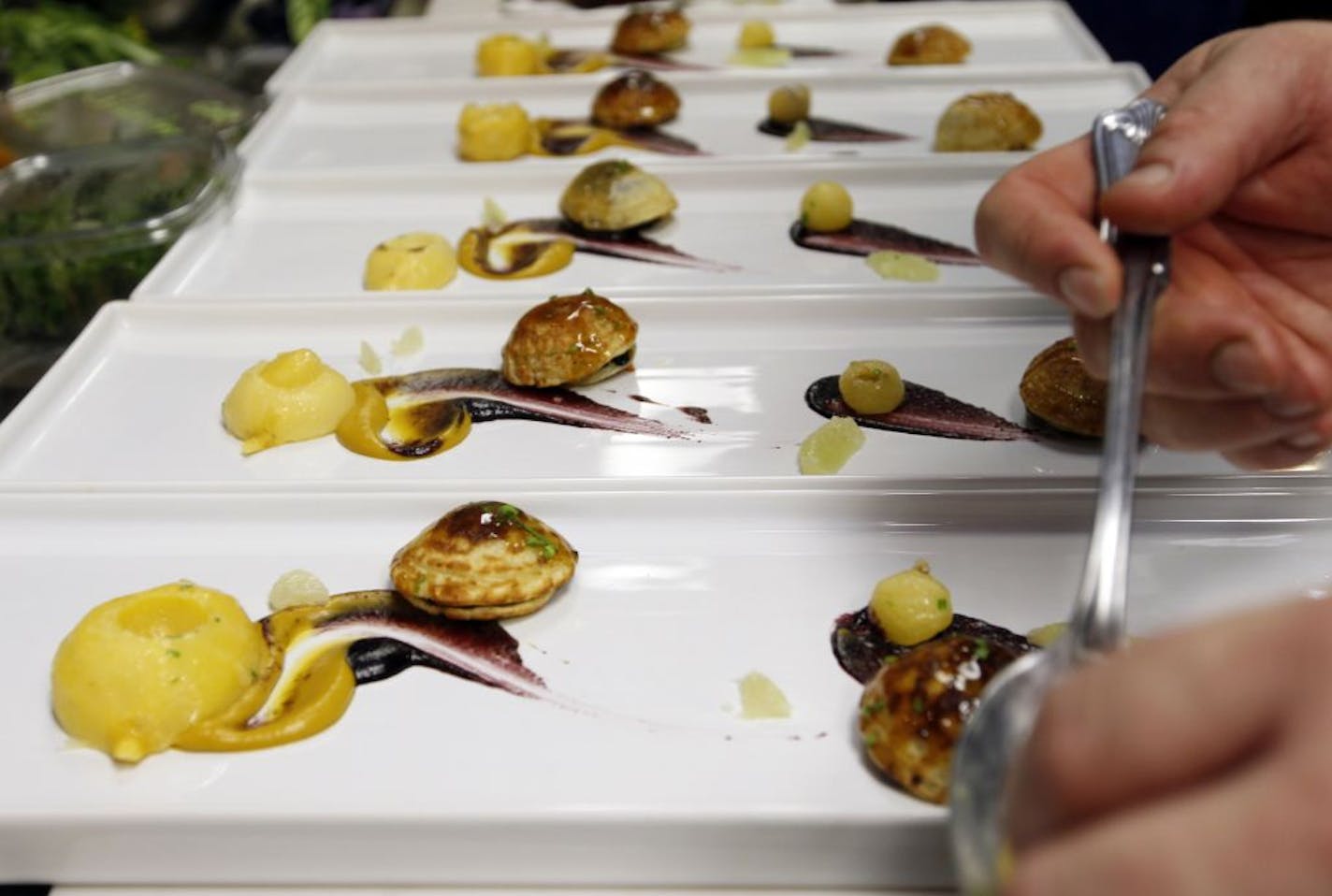 A first timer at the restuarant, Pancakes with a fruit filling. The Travail crew with owners, Bob Gerken, Mike Brown and James Winberg are part a new chef series we are starting in the taste section. [ TOM WALLACE • twallace@startribune.com _ Assignments # 20021974A_ February 15, 2011_ SLUG: Travail0223_ EXTRA INFORMATION: