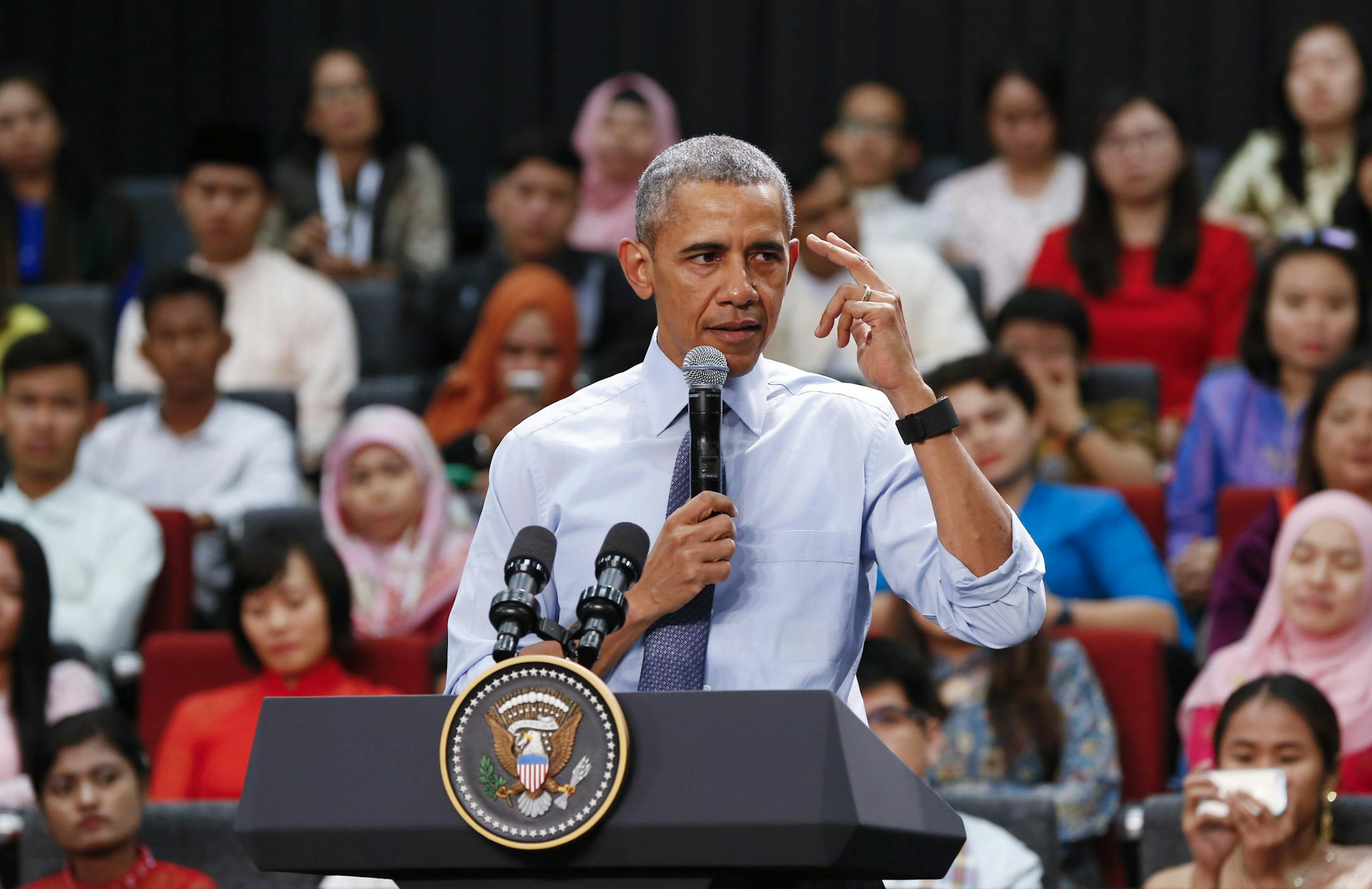 U.S. President Barack Obama gestures as he speaks at the Young Southeast Asian Leaders Initiative (YSEALI) during a town hall meeting at Taylor's University in Kuala Lumpur, Malaysia, Friday, Nov. 20, 2015. Obama urged young people in predominantly Muslim Malaysia on Friday to reject the “terrible vision” that drove the Paris attacks, offering an alternative vision in which traditional cultures coexist with a diverse modern world. (AP Photo/Vincent Thian)