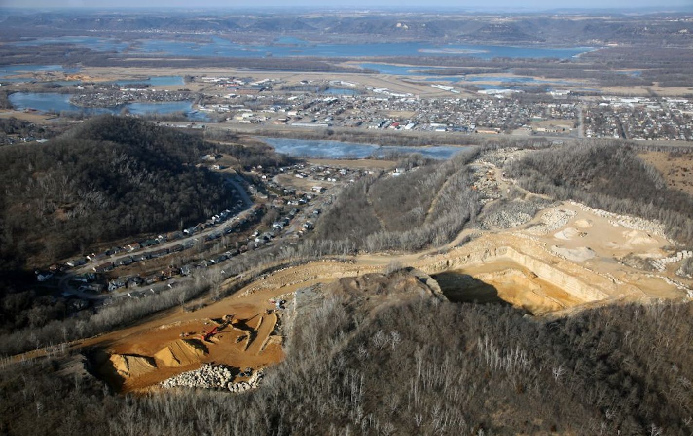 Nowhere are the concerns about sand mining, and expectations for its economic potential, more palpable than in the town of Winona. It's also becoming a lesson in how communities cope with a new industry that is booming in lock step with the business it supplies – the controversial oil and gas drilling practice called hydro fracking. (IN THIS PHOTO) Aerial views of the Biesanz Stone Company and the frac sand mining opperation.