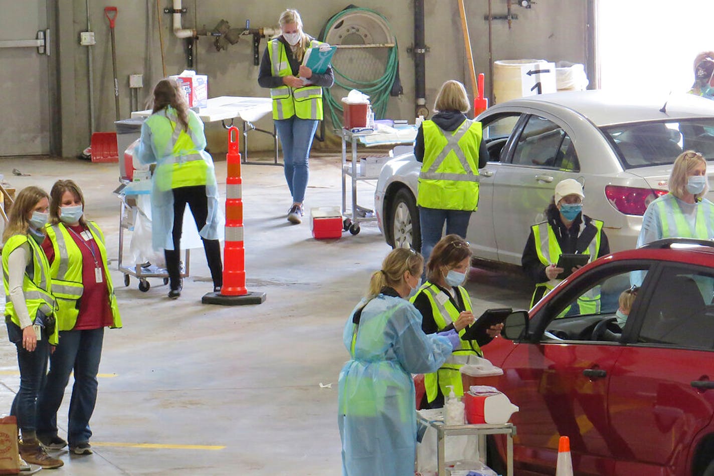 Carlton County's drive-thru flu shot clinic in Carlton, Minn. The facility is a way to social distance in the coronavirus pandemic, but also served as a test run for the COVID-19 vaccines that county health officials still know little about.