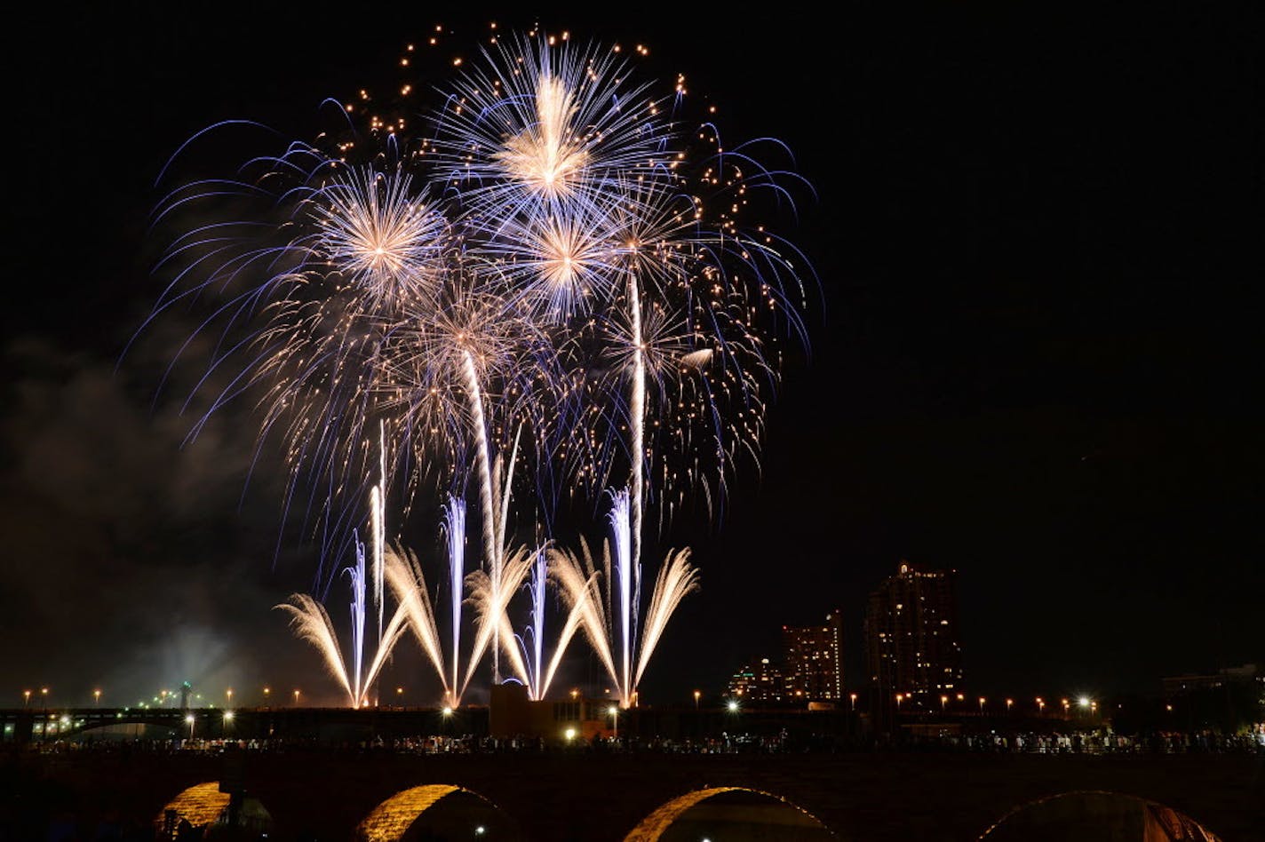 Aquatennial fireworks exploded over the Stone Arch bridge in Minneapolis.