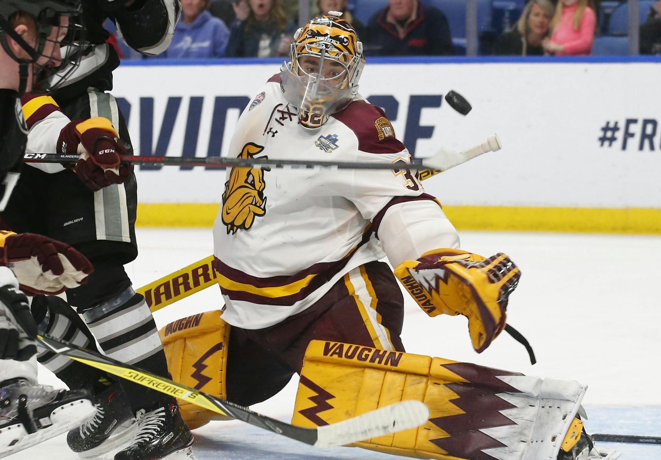 Minnesota-Duluth goalie Hunter Shepard (32) makes a save against Providence during the third period in a semifinal of the Frozen Four NCAA men's college hockey tournament Thursday, April 11, 2019, in Buffalo, N.Y. (AP Photo/Jeffrey T. Barnes)