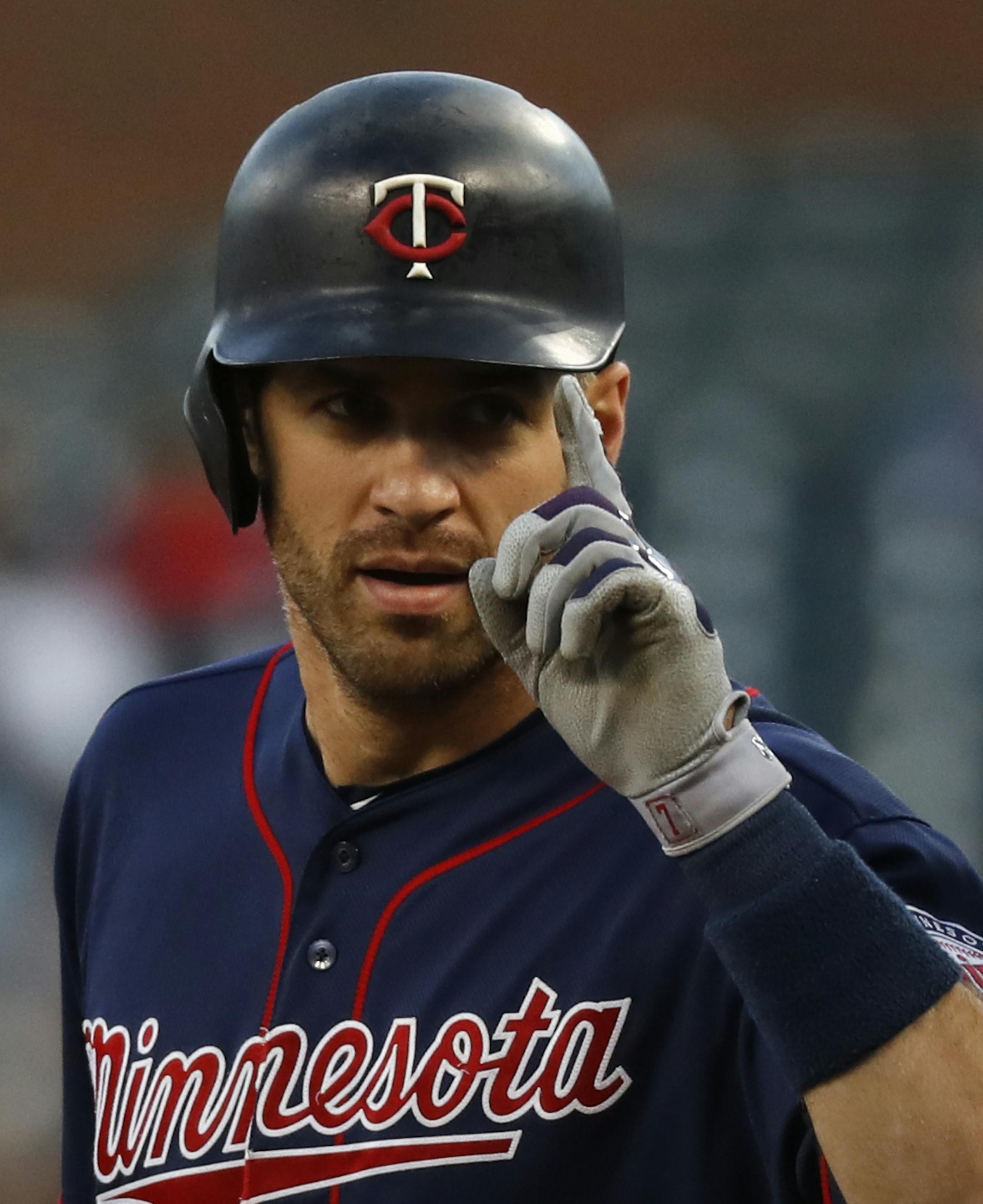 Minnesota Twins' Joe Mauer celebrates his single against the Detroit Tigers in the first inning of a baseball game in Detroit, Tuesday, Sept. 18, 2018. (AP Photo/Paul Sancya)