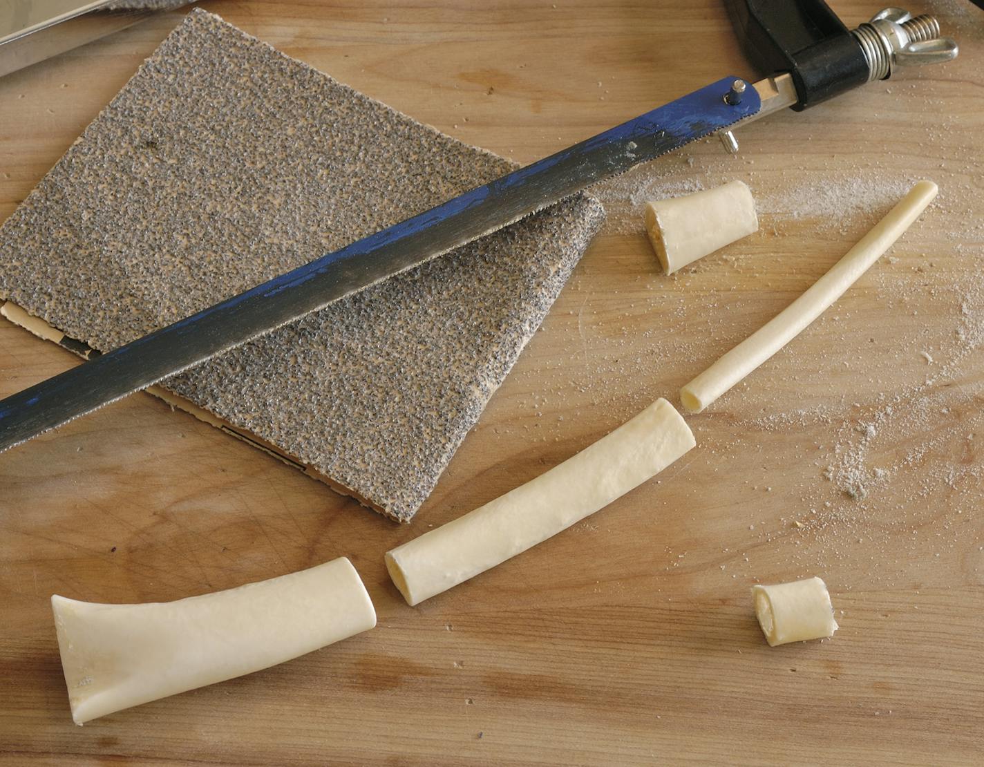 Cut the bones with a hack saw and bevel the ends with sandpaper so they find snuggly together.