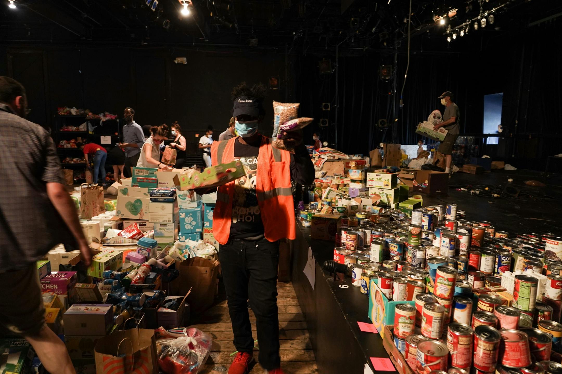 Volunteers organized donations at the Mixed Blood Theatre which is operating as an emergency food shelter for neighbors.