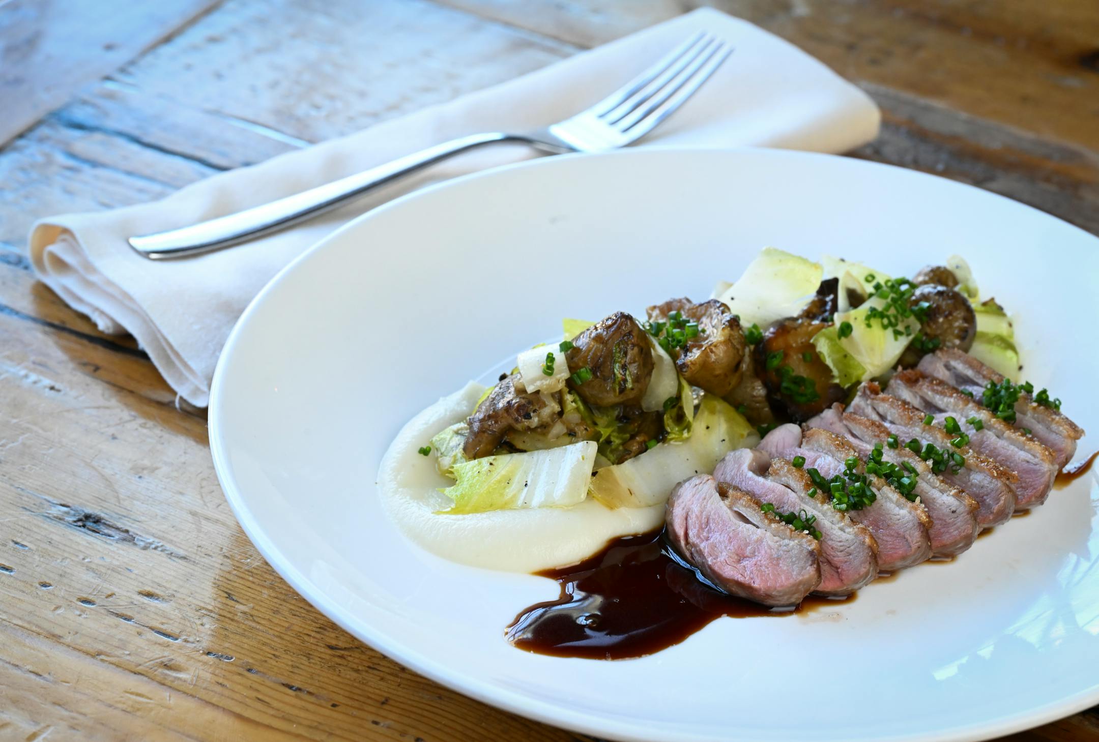 The Wild Acres duck with sunchoke, endive, and sauce perigord at The Kenwood.