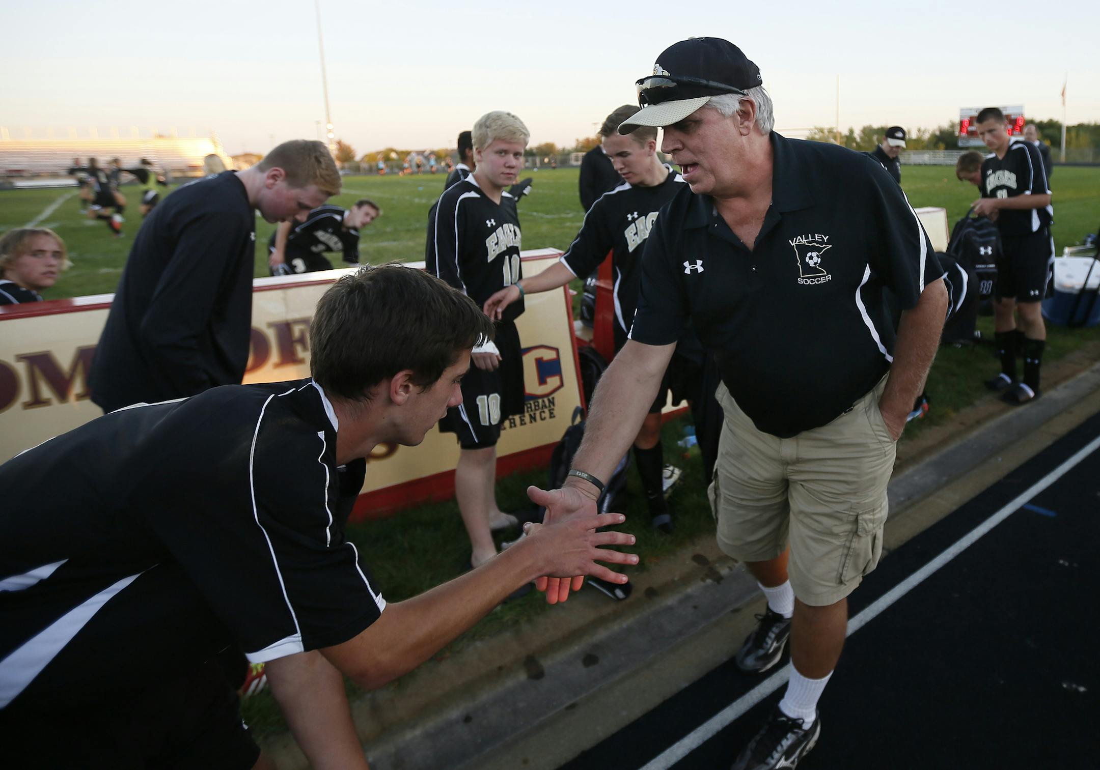 Chuck Scanion head coach of Apple Valley shook hands with Andy Joerger after the beat Lakeville South in soccer Tuesday October 01, 2013 in Lakeville, MN.] JERRY HOLT ‚Ä¢ jerry.holt@startribune.com