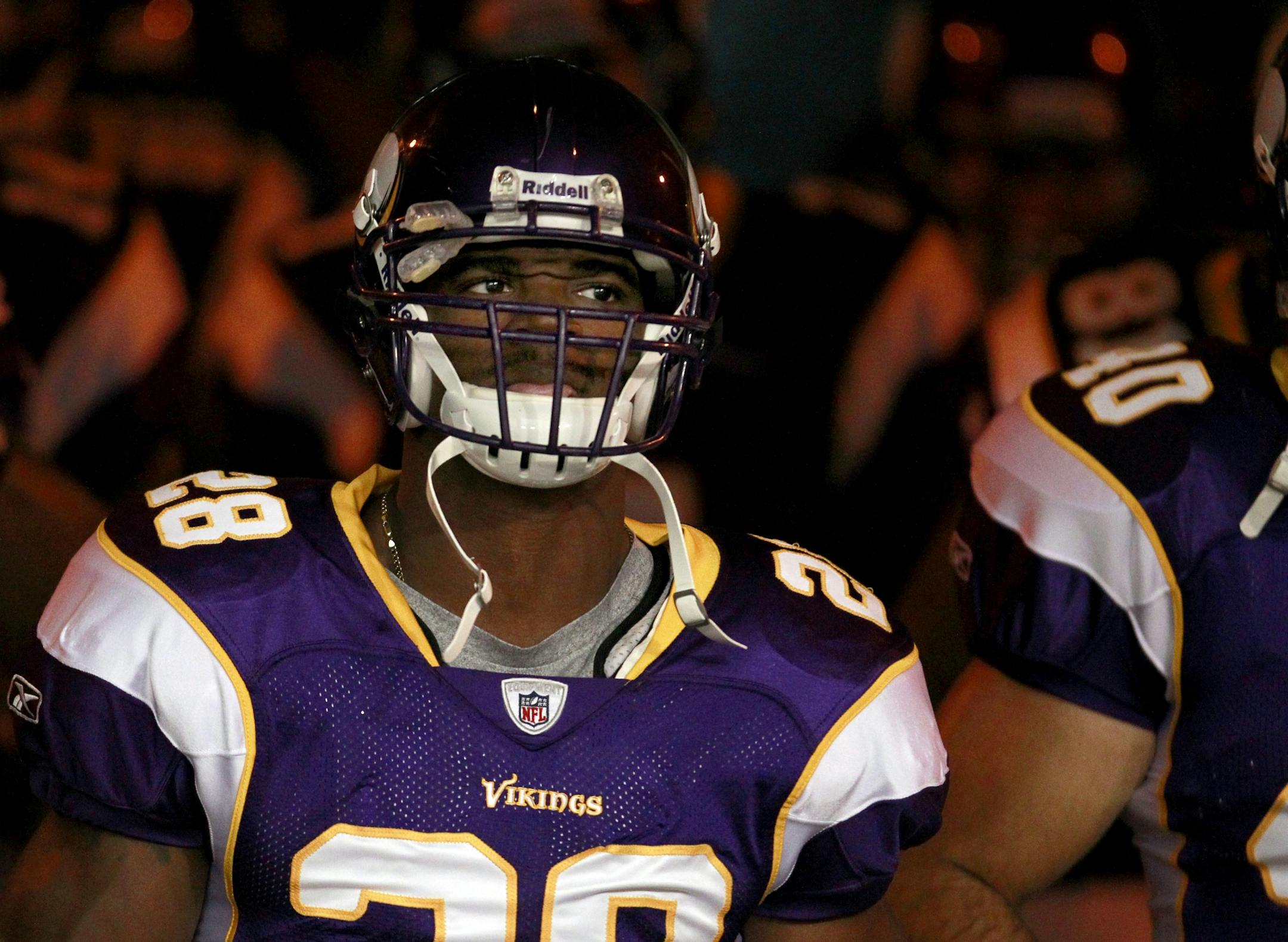 Minnesota Vikings running back Adrian Peterson (28) and teammates walked through the tunnel onto the field for team warm ups before Sunday's game.