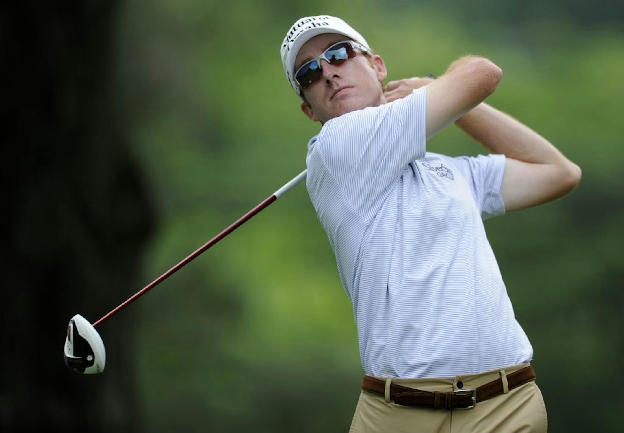 Roberto Castro watches his tee shot on the third tee during the first round of the AT&T National Golf tournament, Thursday, July 27, 2013, in Bethesda, Md.