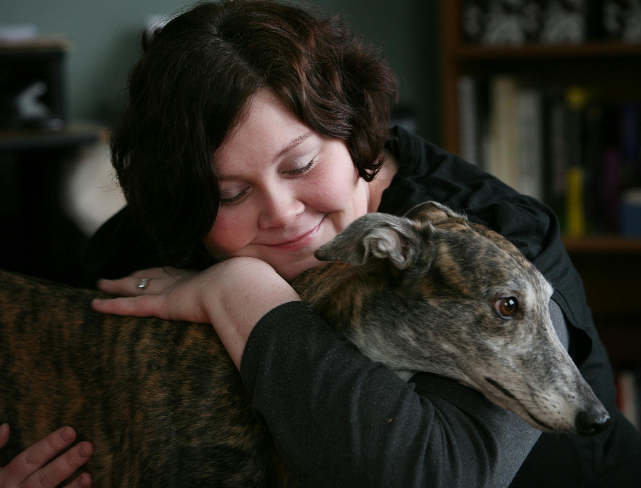 Morgan Wylie (with greyhound Kiba) used to think about food all the time, hiding it in filing cabinets and obsessively planning her life around it. She found help for her binge eating through the Emily Program