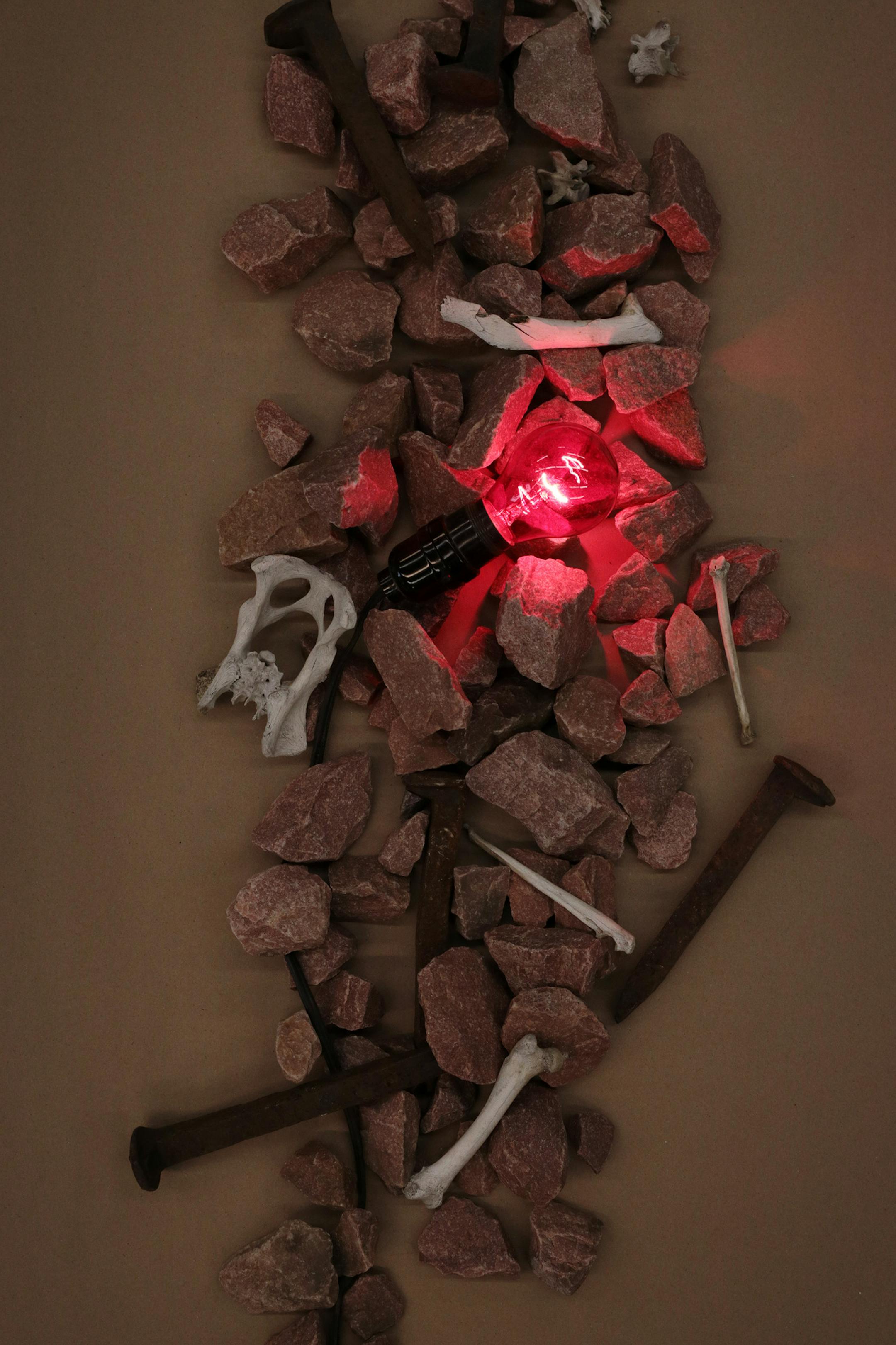 Bones, rocks, and railroad spikes form "The Spook Light of Brewery Hill," a found object sculpture by Kuehn. ] ANTHONY SOUFFLE • anthony.souffle@startribune.com Artist Brandon Kuehn, who travels the state of Minnesota visiting sites of paranormal activity and then make art inspired by it, sat for a portrait Tuesday, Dec. 13, 2016 at his studio in Anoka, Minn.