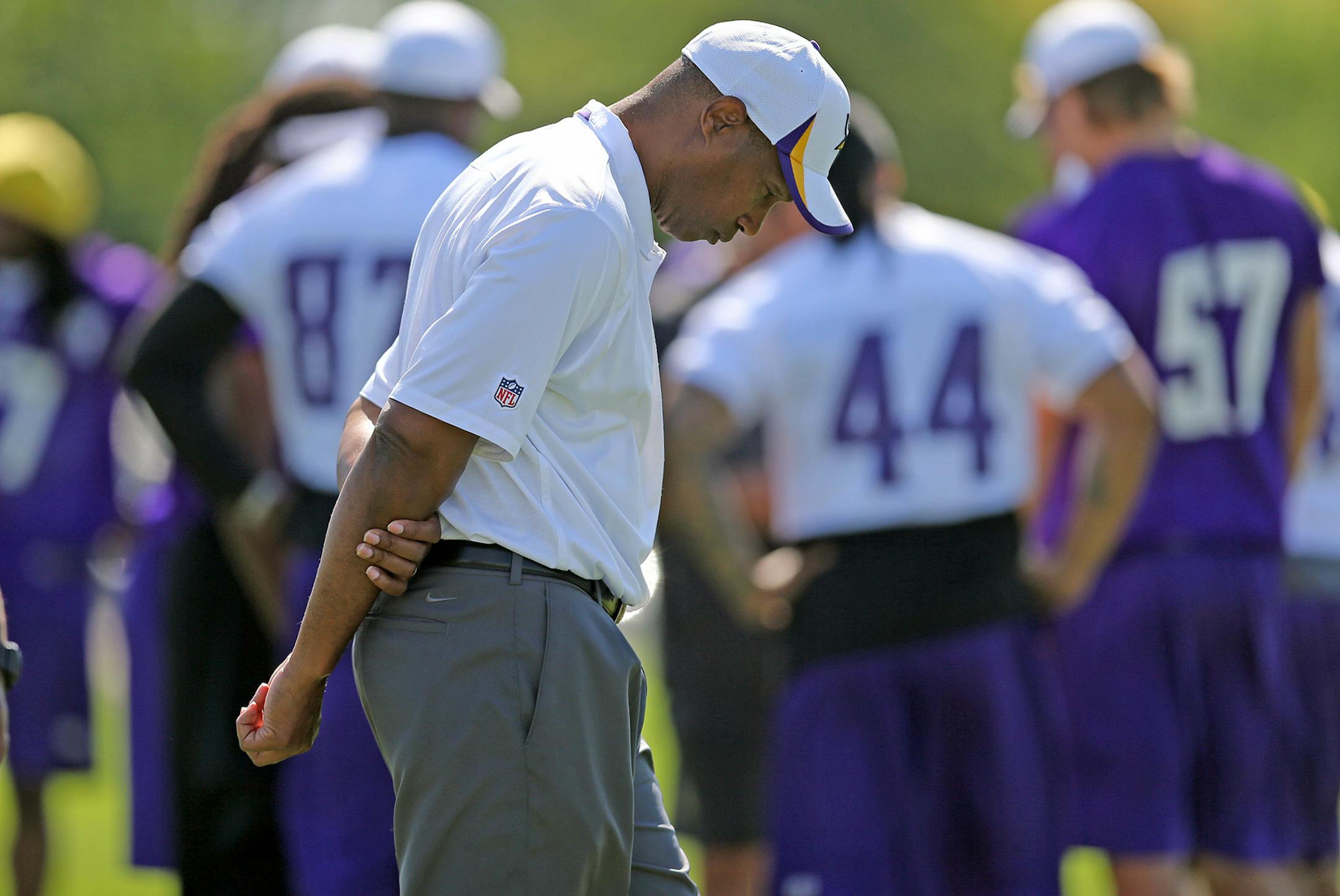 Vikings coach Leslie Frazier made his way across the field during training camp on Monday in Mankato