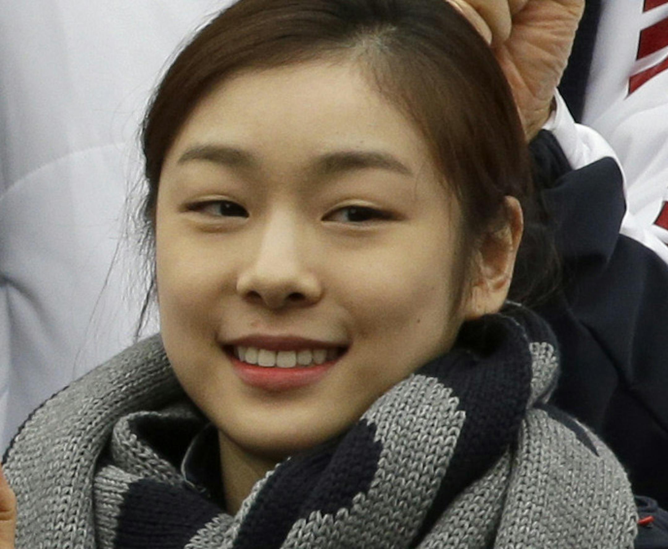 South Korean Prime Minister Chung Hong-won poses with Kim Yu-na, right, Vancouver gold medalist for the women's figure skating, and Lee Sang-hwa, left, Vancouver gold medalist for skating, after the inaugural ceremony of South Korean national team for the Sochi Winter Olympics in Seoul, South Korea, Thursday, Jan. 23, 2014. South Korea will send 64 athletes to Sochi which will be held from Feb. 7-23. (AP Photo/Lee Jin-man)
