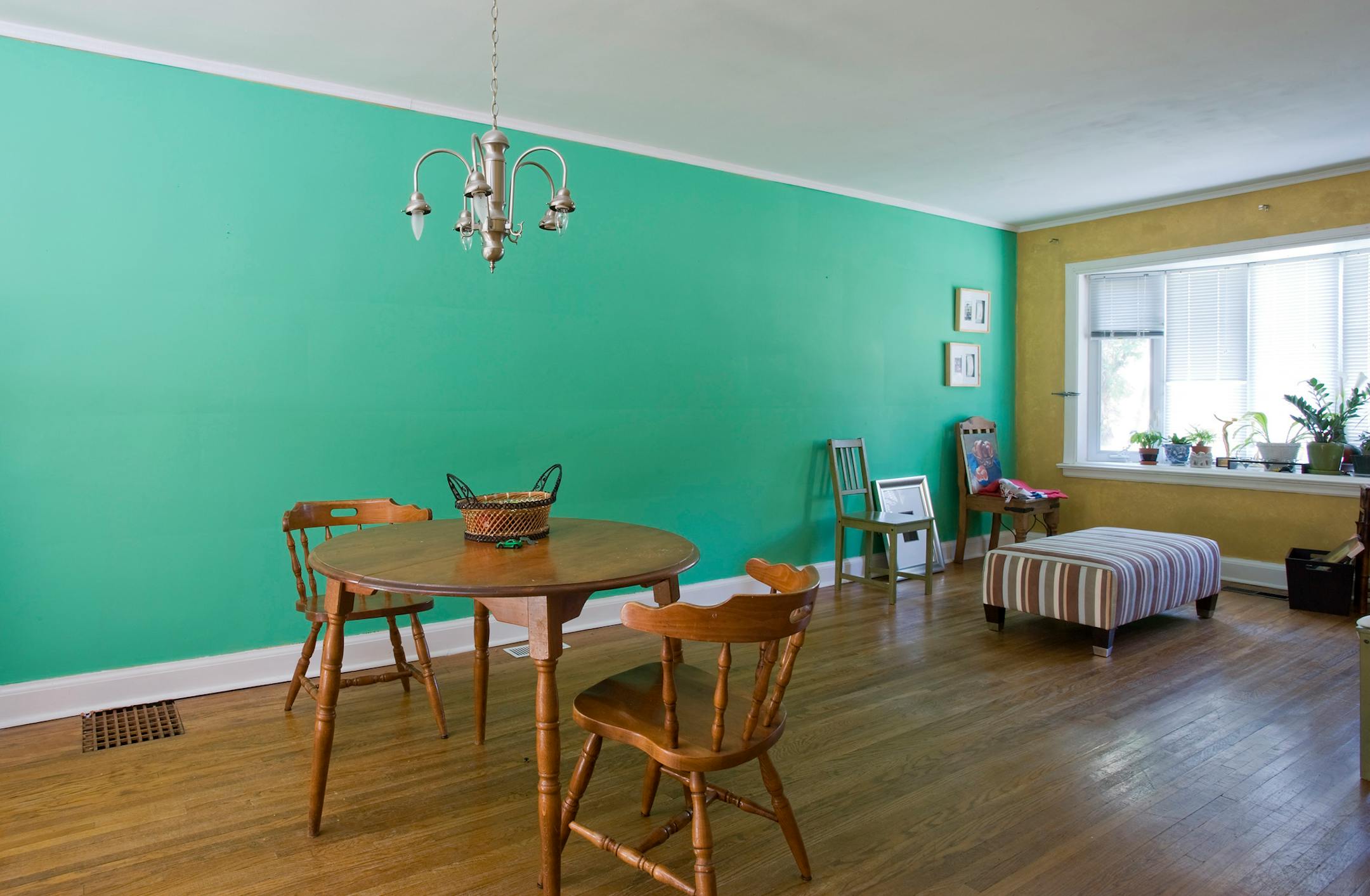 Minty paint, nondescript flooring and a lack of furniture.