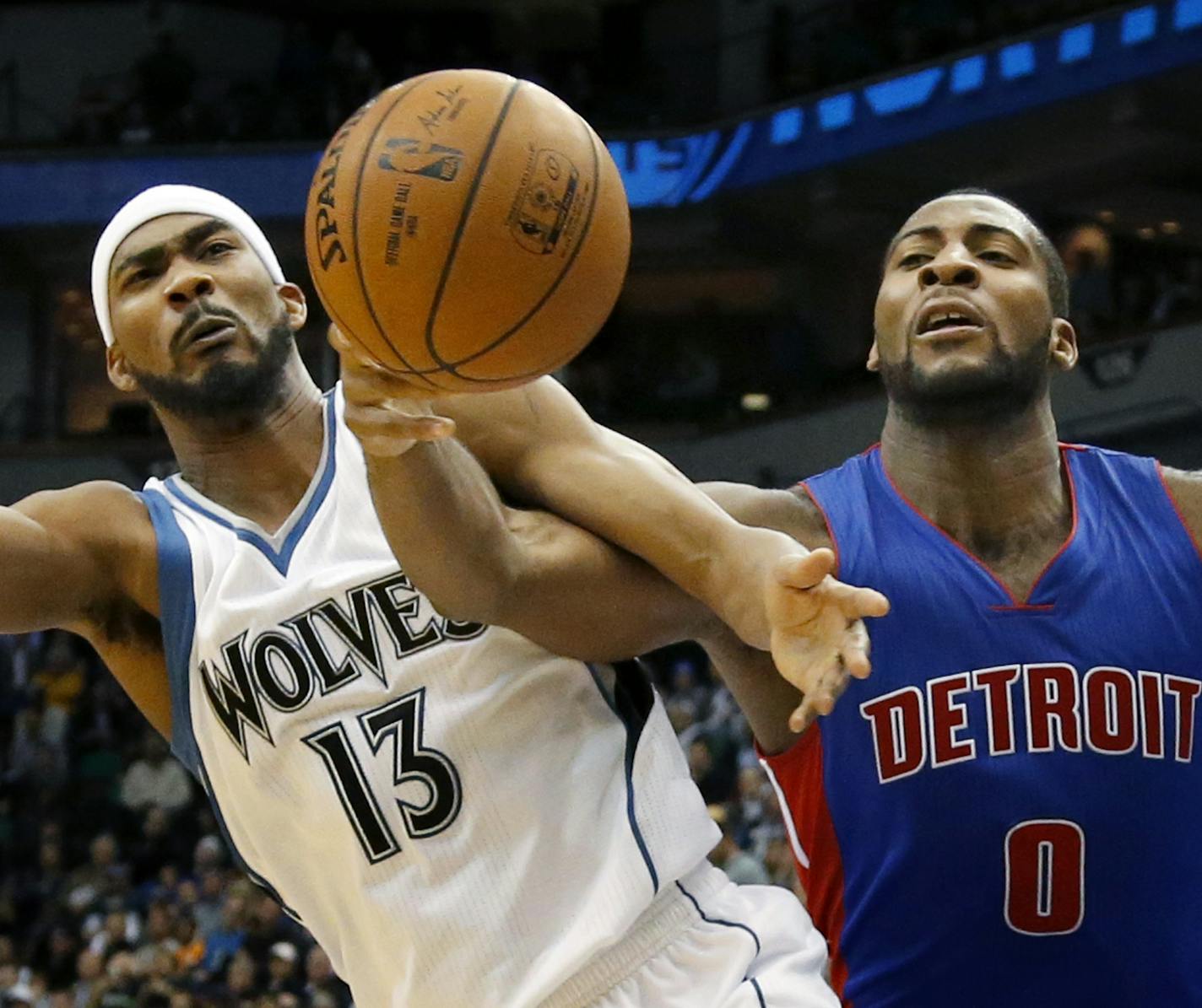 Corey Brewer (13) and Andre Drummond (0) fought for a rebound in the fourth quarter. Minnesota beat Detroit by a final score of 97-91. ] CARLOS GONZALEZ cgonzalez@startribune.com - October 30, 2014, Minneapolis, Minn., Target Center, NBA, Minnesota Timberwolves vs. Detroit Pistons, Home Opener