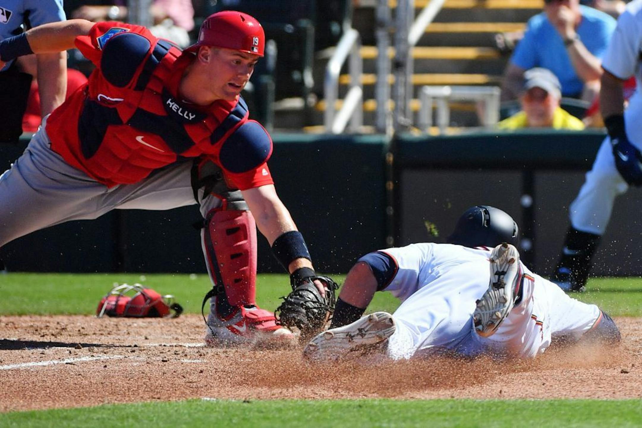 Cardinals catcher Carson Kelly tagged out Twins second baseman Brian Dozier (2) at home in the third inning.