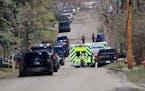 Law enforcement lines the streets near Mayview Road and North St. in Minnetonka on Wednesday.
