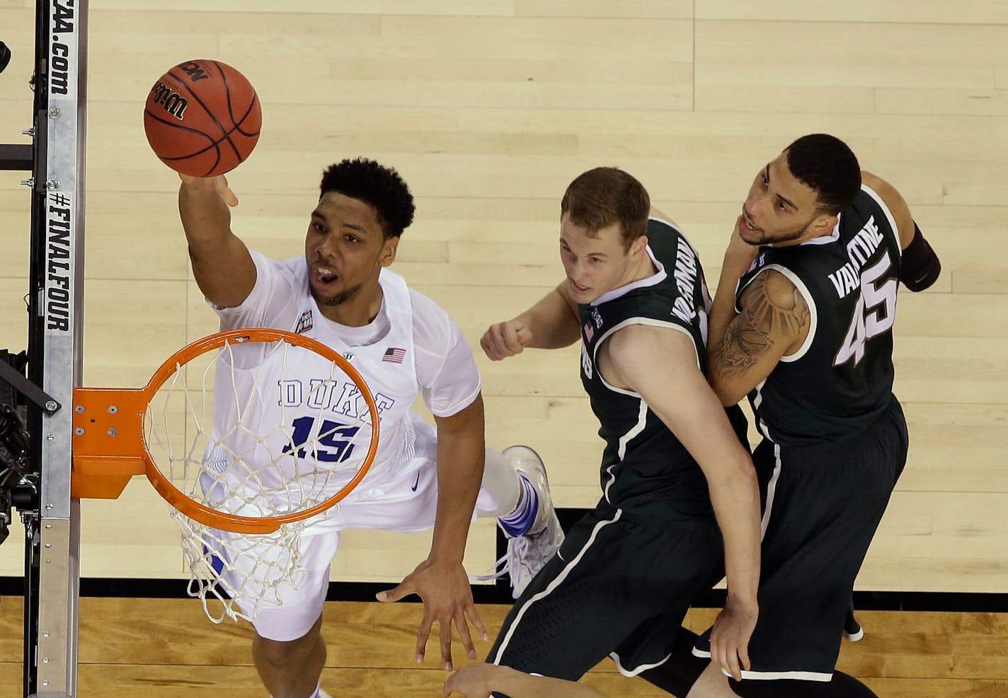 Duke's Jahlil Okafor (15) is a precociously skilled big man who has been getting national acclaim since he became a teenager. He'll be one of the top four picks in the NBA draft in June.