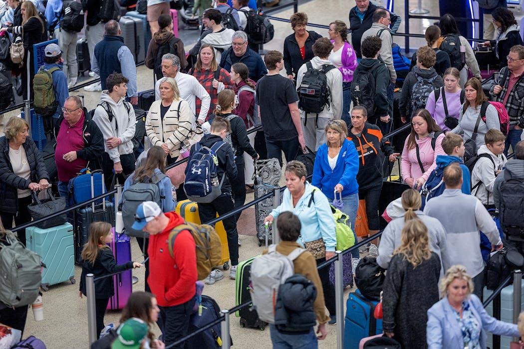 Travelers waited in check-in lines in Terminal 2 at MSP Airport in Bloomington on Thursday.