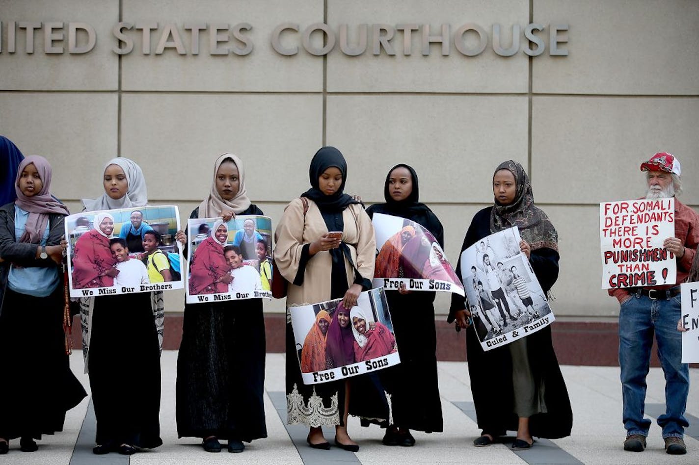 Supporters and family members of young Somali men standing trial, stood for a small protest before the opening day of the ISIL recruit trial, in front of the United States Courthouse, Monday, May 9, 2016 in Minneapolis, MN.