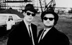 March 10, 1982 "The Blues Brothers" The Blues Brothers (John Belushi (r) and Dan Aykroyd) with the Bluesmobile in Chicago.