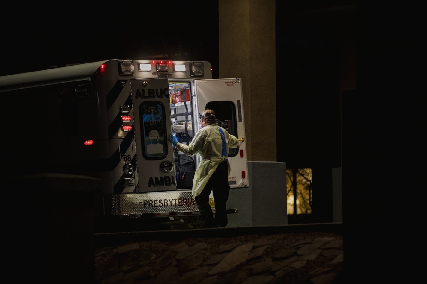 An EMT loads a COVID-19 patient into an ambulance in Albuquerque, N.M., on Nov 24.