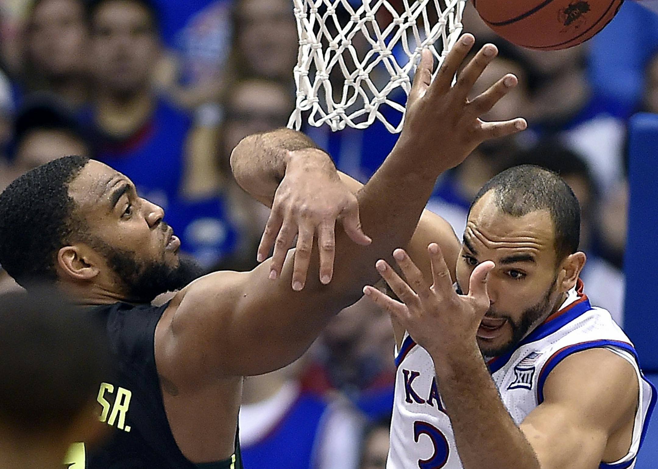 Kansas' Perry Ellis, right, battles Baylor's Rico Gathers for a rebound during the second half at Allen Fieldhouse in Lawrence, Kan., on Saturday, Jan. 2, 2016. KU won, 102-74. (Rich Sugg/Kansas City Star/TNS)