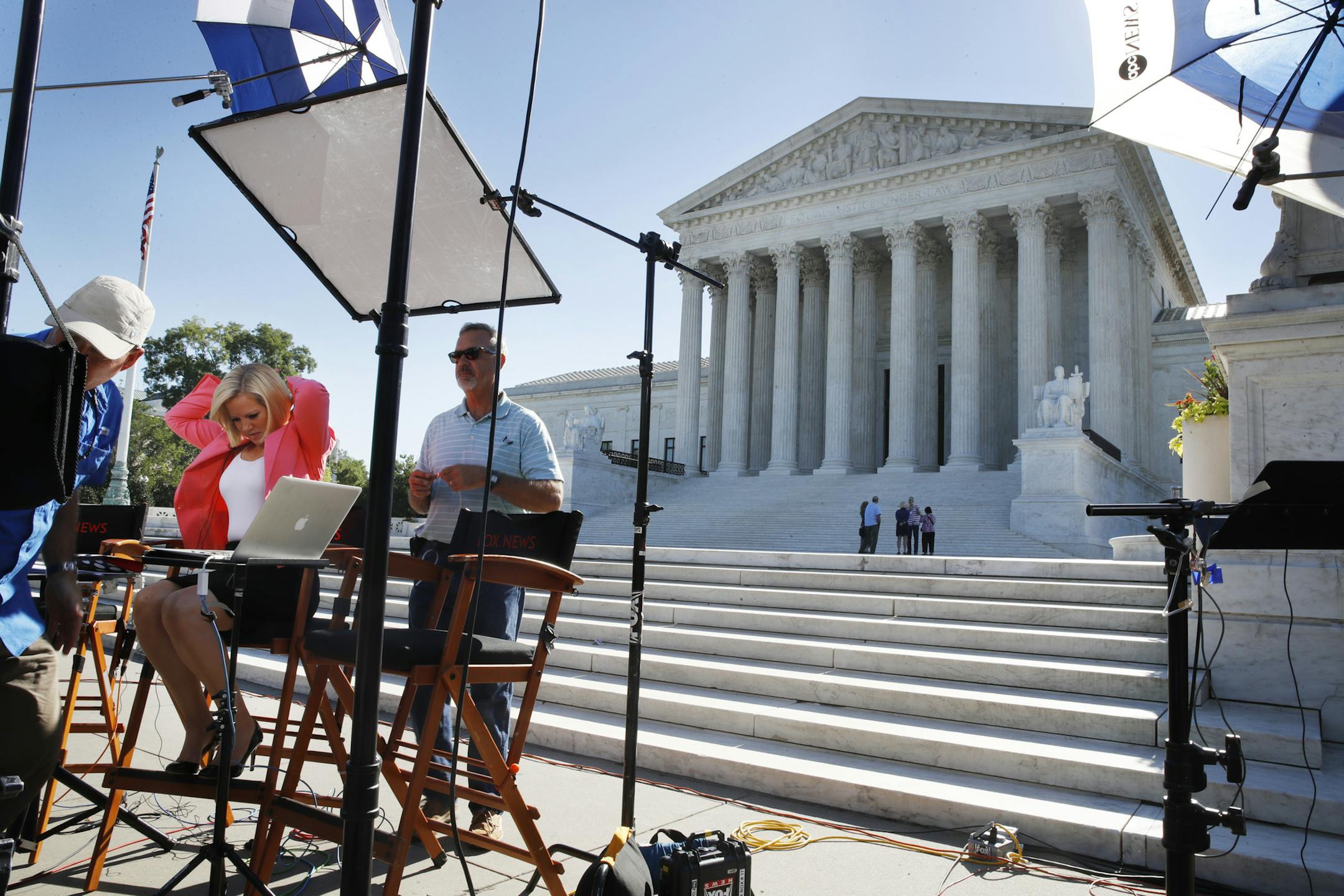 Television crews set up in front of the Supreme Court, Monday, July 9, 2018, in Washington. President Donald Trump is expected to announce his choice on a replacement for retiring Supreme Court Justice Anthony Kennedy Monday evening. (AP Photo/Jacquelyn Martin)