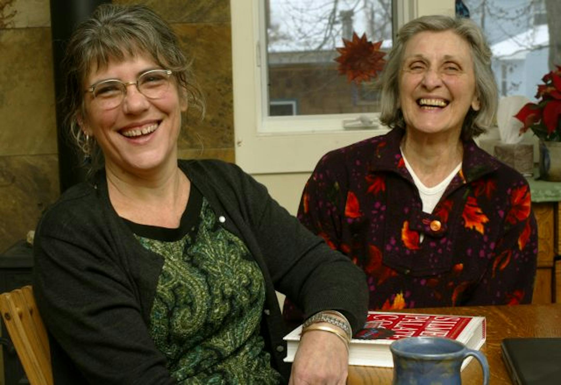 Sara Langworthy and her mother Alice Langworthy share a laugh in the kitchen of their St. Paul home, which they share.