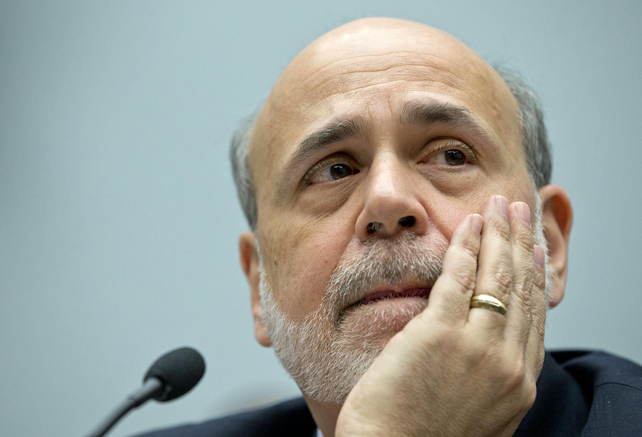 Federal Reserve Chairman Ben Bernanke pauses to listen to questions as he testifies on Capitol Hill in Washington in February.