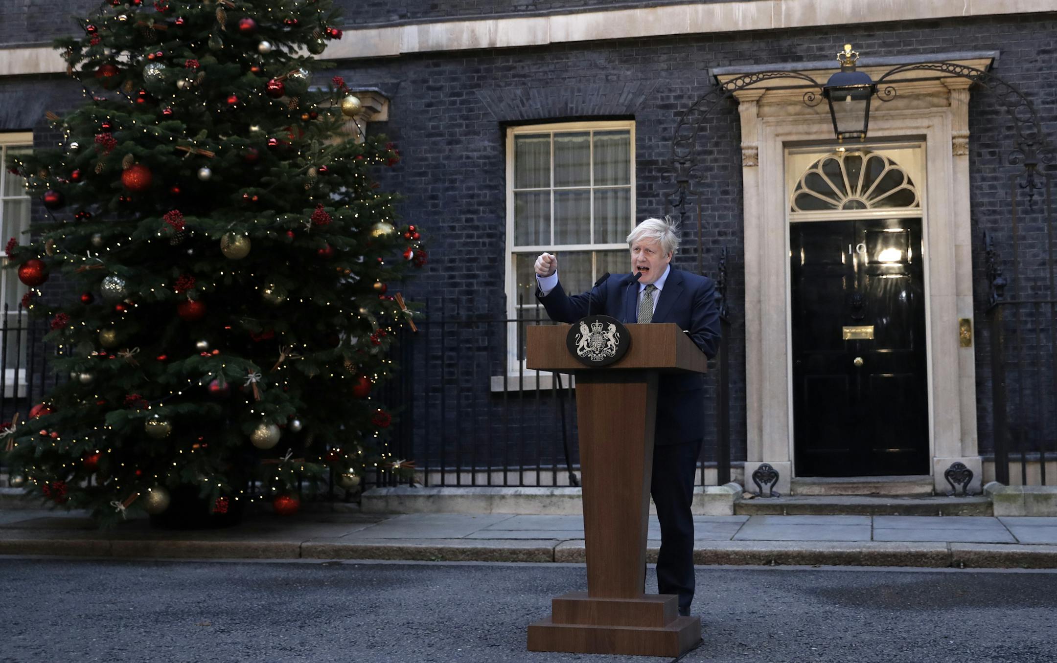 Britain's Prime Minister Boris Johnson speaks outside 10 Downing Street in London on Friday, Dec. 13, 2019. Boris Johnson's gamble on early elections paid off as voters gave the UK prime minister a commanding majority to take the country out of the European Union by the end of January, a decisive result after more than three years of stalemate over Brexit. (AP Photo/Matt Dunham)