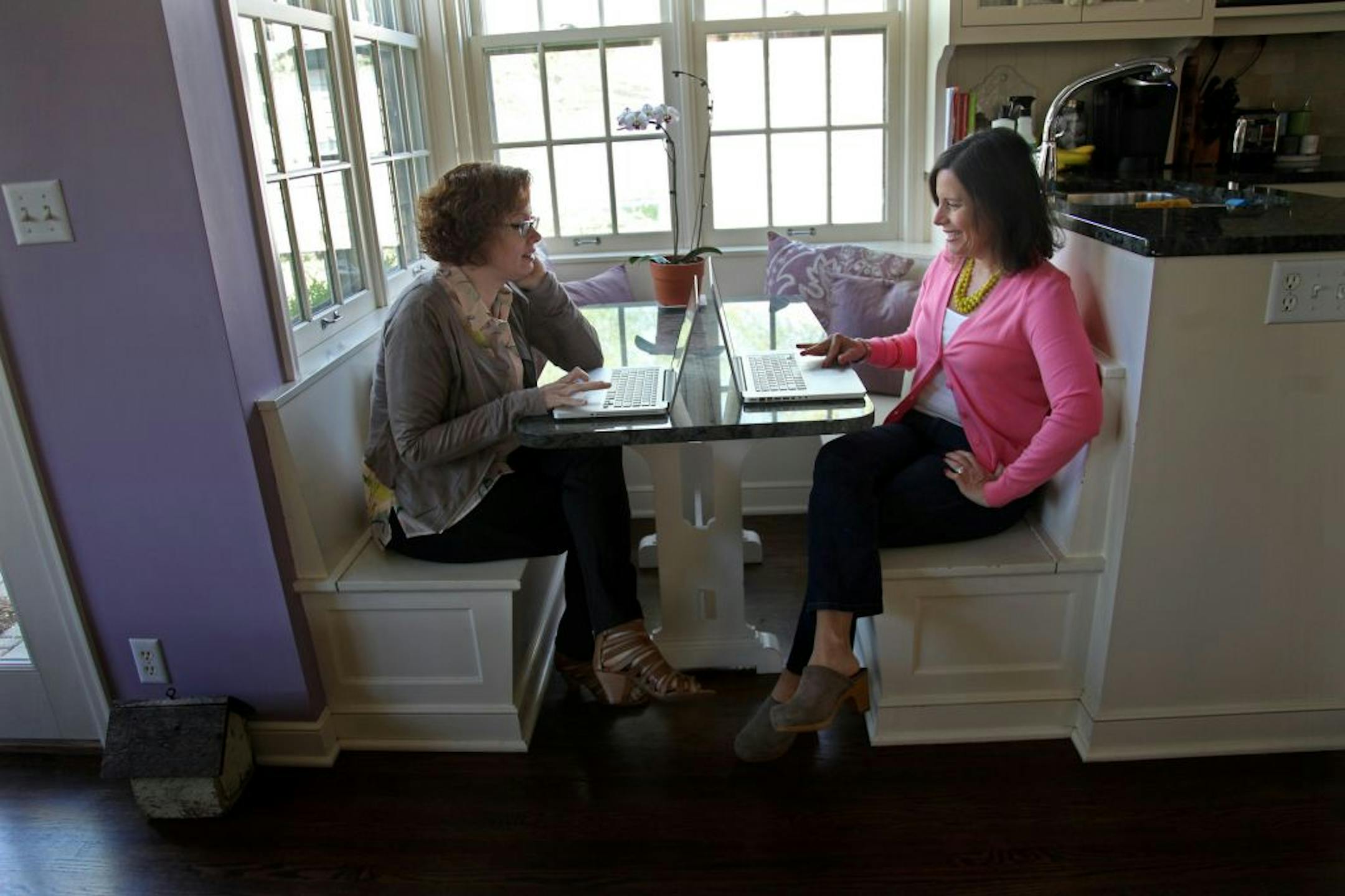 Mary Van Note, left, and Beth Perro-Jarvis, partners in Ginger, a research consulting group in Minneapolis, who do an annual "What Women Want" survey, worked from Perro-Jarvis' home, Tuesday, April 17, 2012 in Minneapolis, MN. Local consumer-research duo Ginger found some interesting updated answers to the age-old question, �what do women want?� after conducting their annual survey of �alpha� women trendsetters in key markets around the country (including here). For example, they could easily li